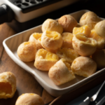 Brazi Bites Cheddar & Parmesan Brazilian Cheese Bread on a plate