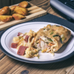 El Monterey Signature Egg Sausage Cheese & Potato Breakfast Burrito on a plate