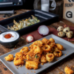 Royal Asia Panko Calamari with Sriracha Aioli on a plate